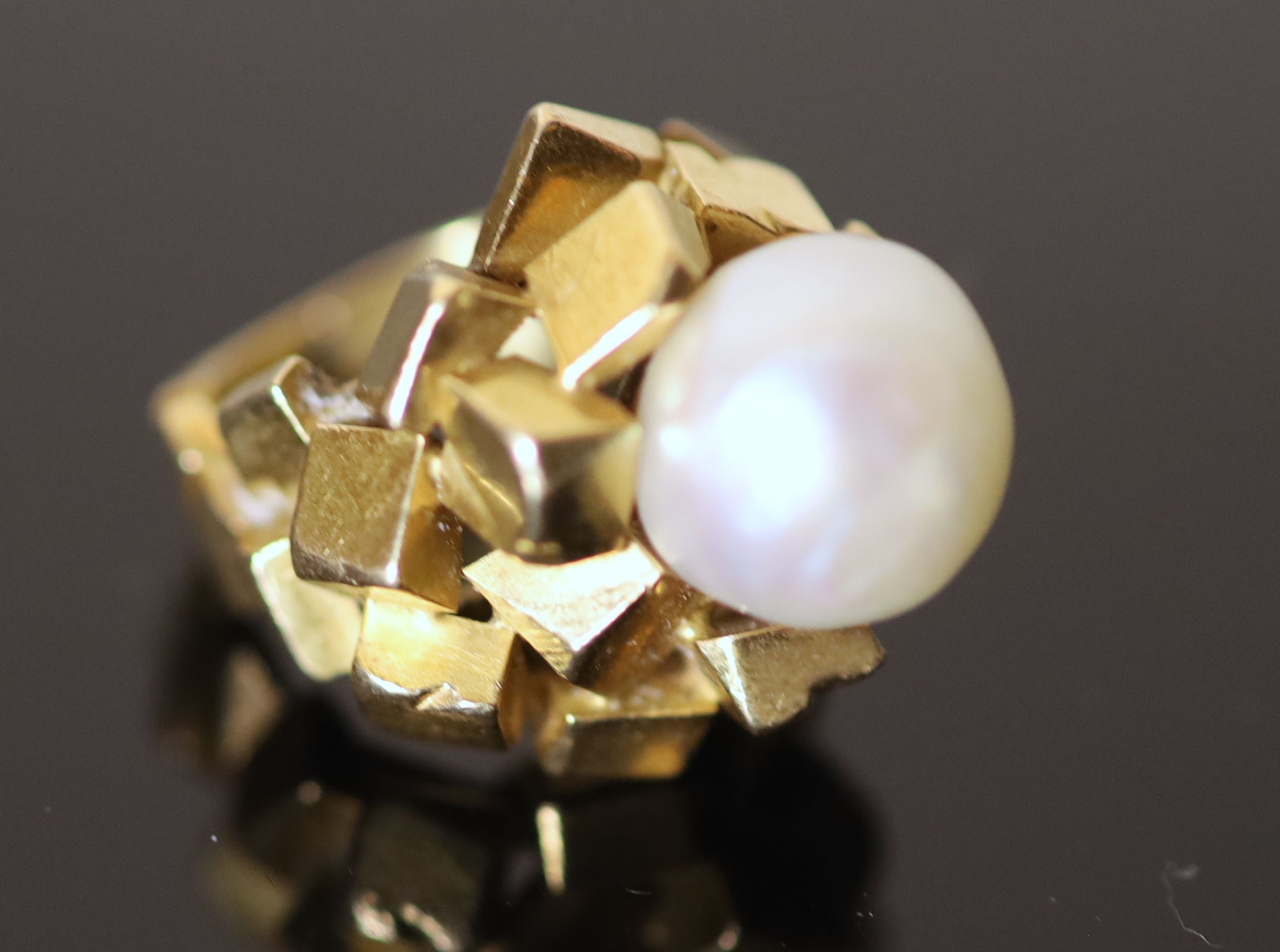 A modern continental 18ct gold (stamped 750) and baroque cultured pearl set modernist dress ring,